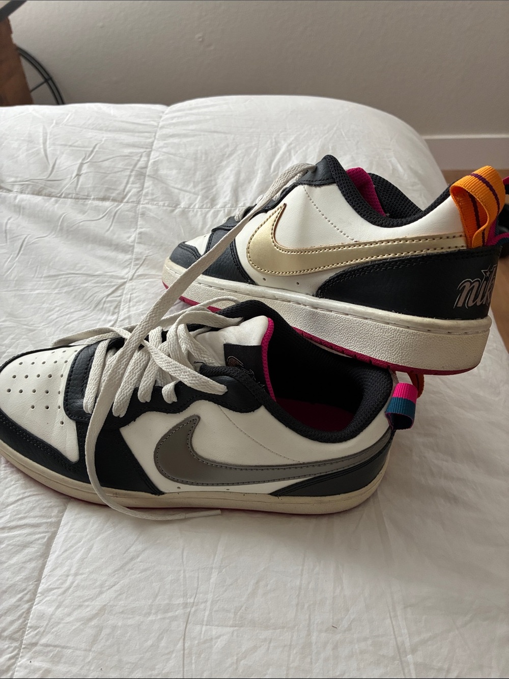 Nike Kids Low-Top Sneakers in White, Black & Gold with Pink Accents